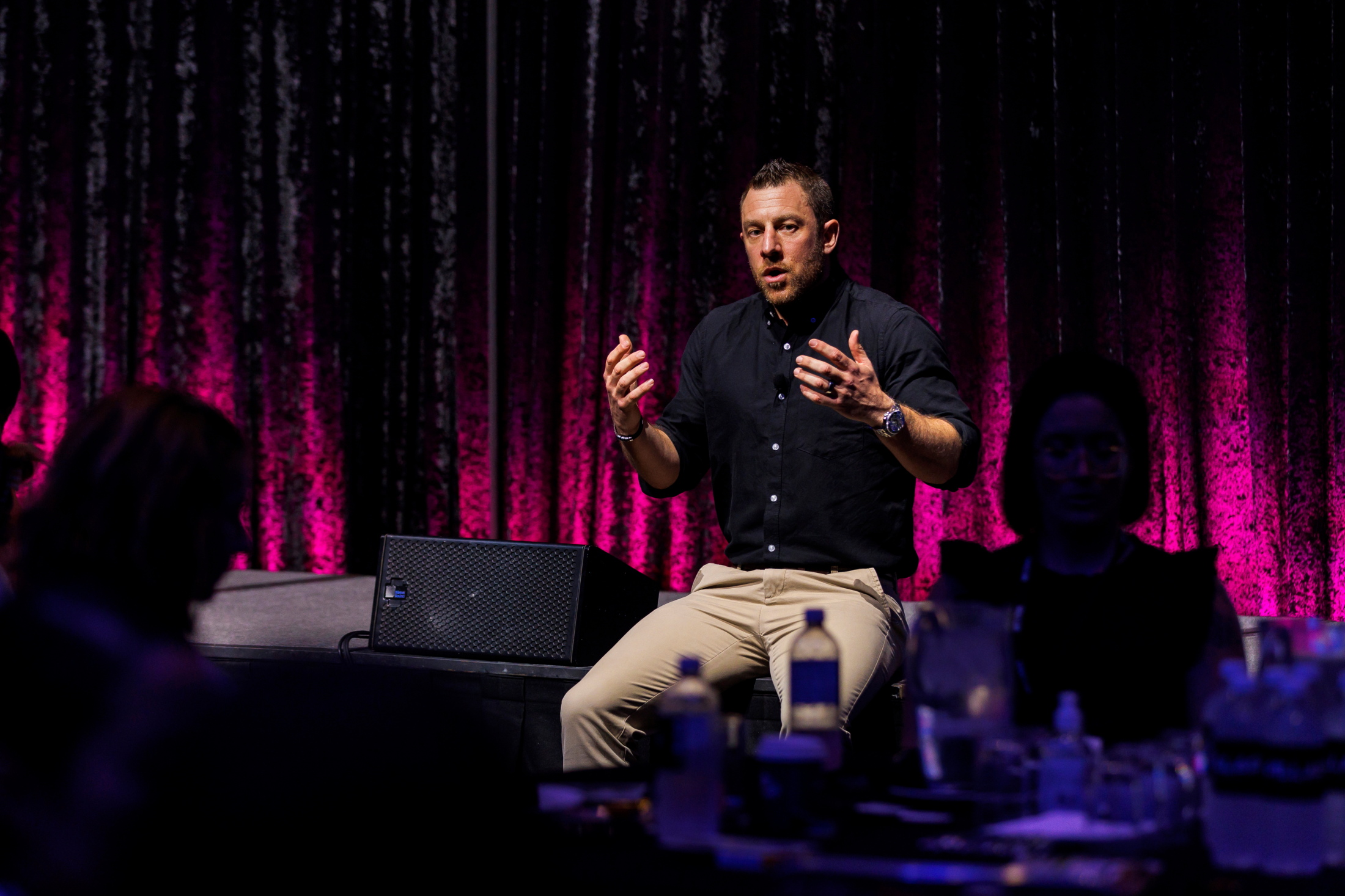 Olly speaking with an audience