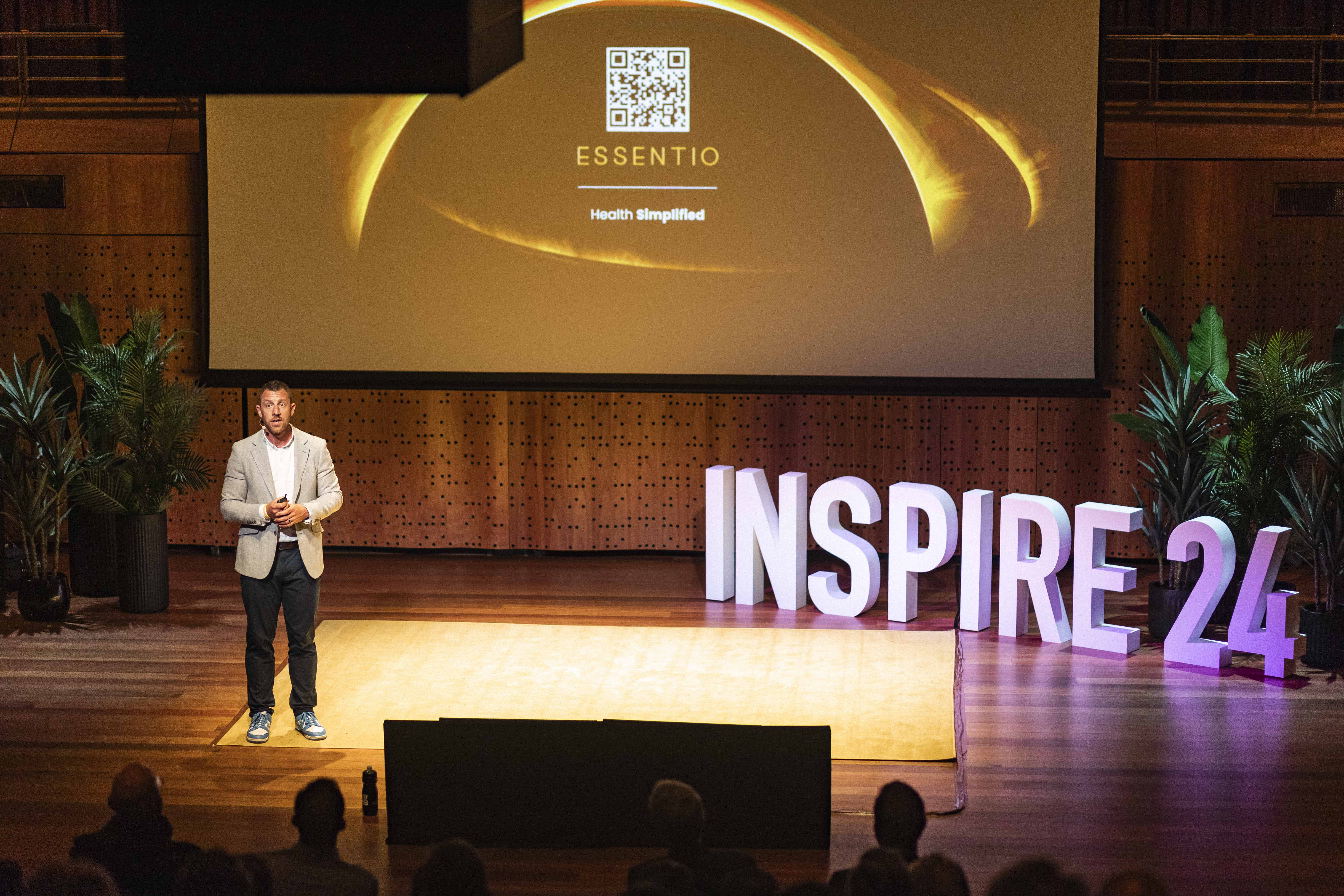 Olly speaking on stage at Inspire 24
